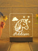 Unicorn-themed night light for kids with name and date and a wooden base